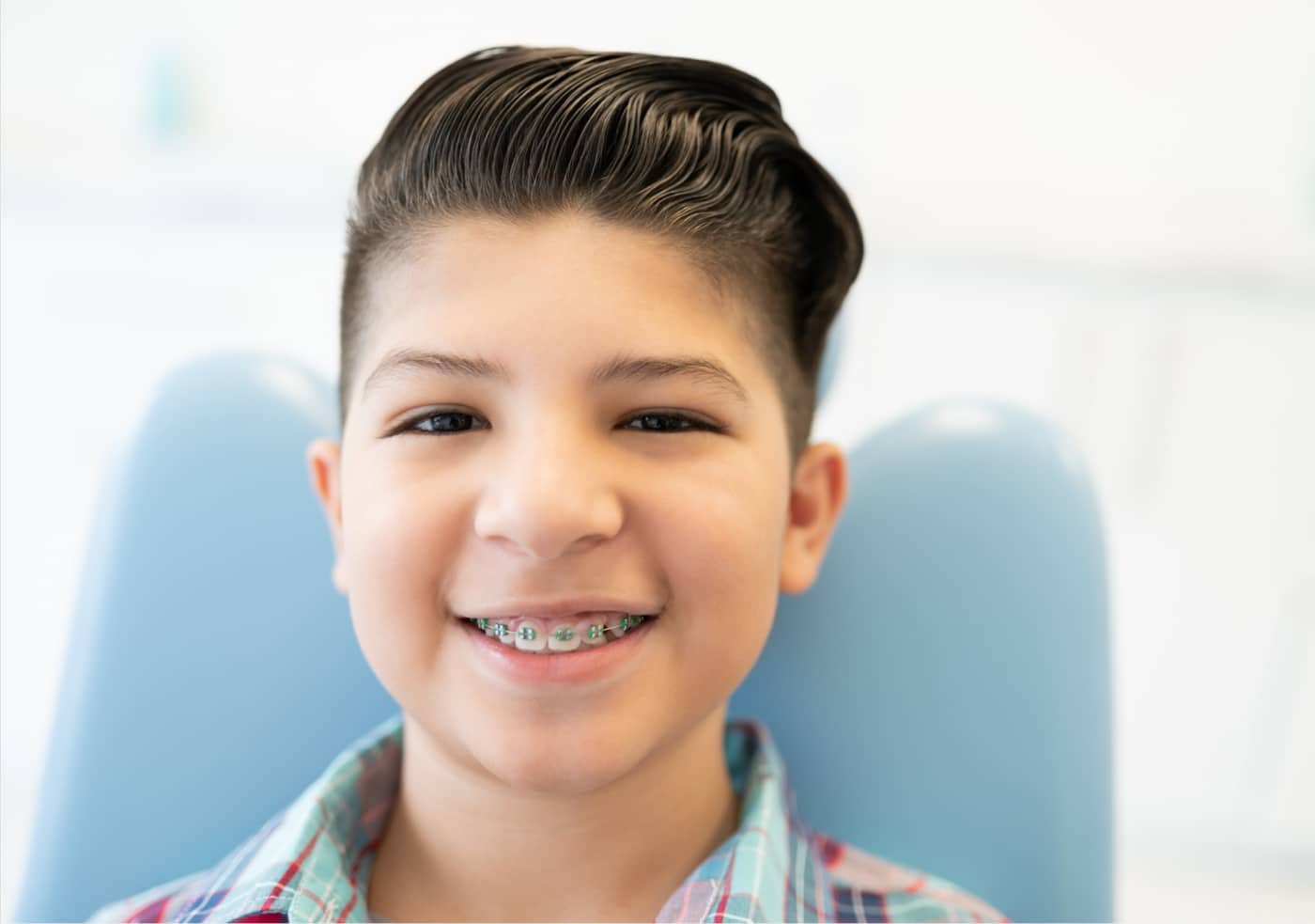 teen smiling with braces on